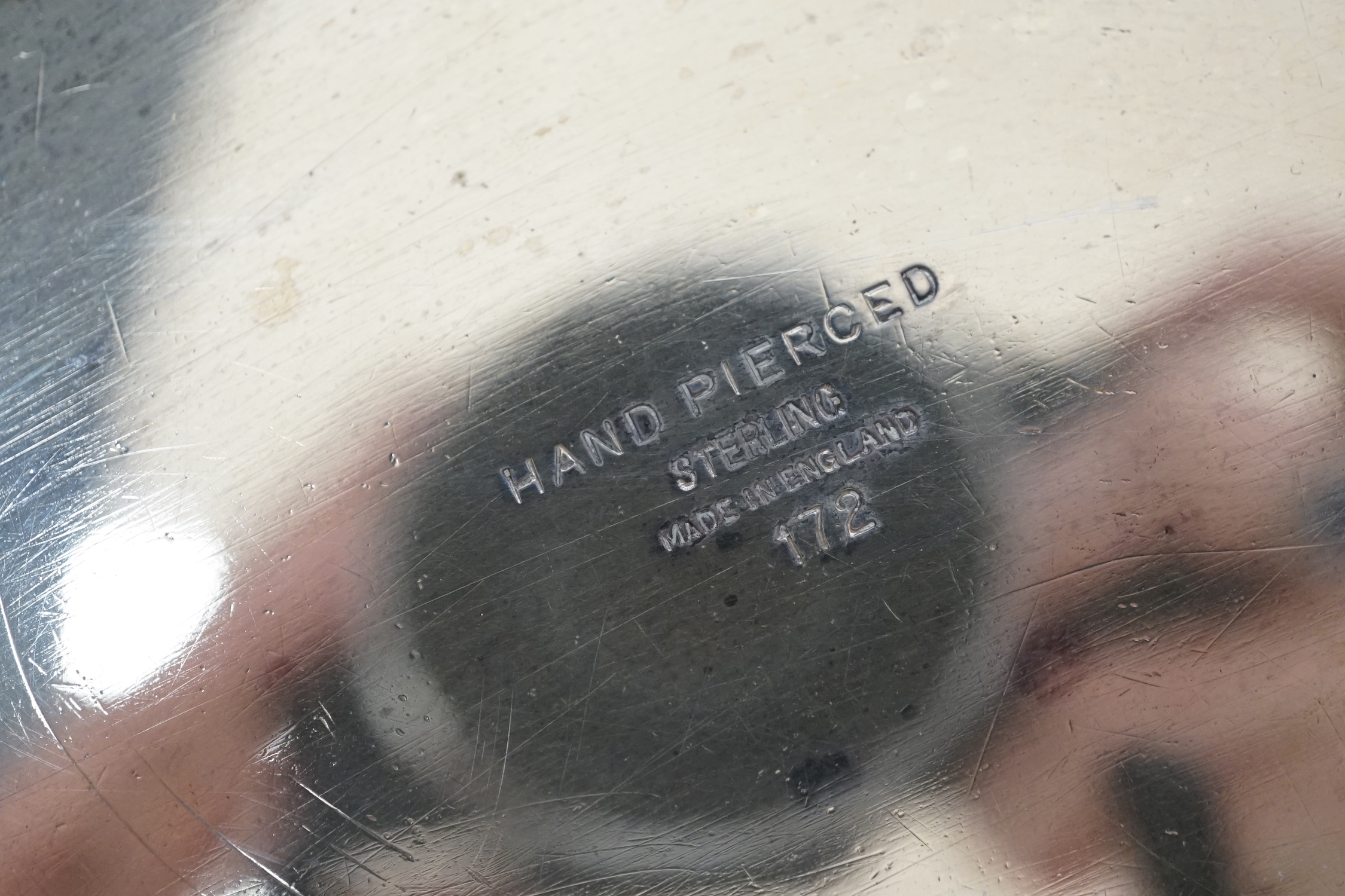 An Elizabeth II pierced silver shallow dish by Viners Ltd, Sheffield, 1955, 29.6cm, 16.9oz.
